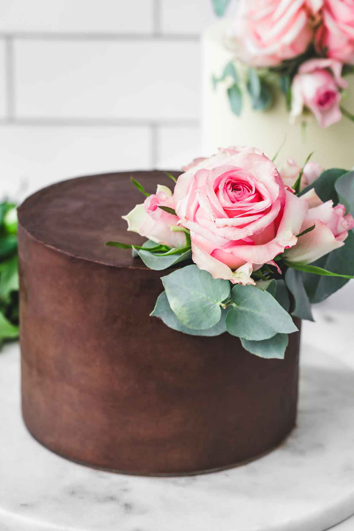ganache covered cake with floral decoration