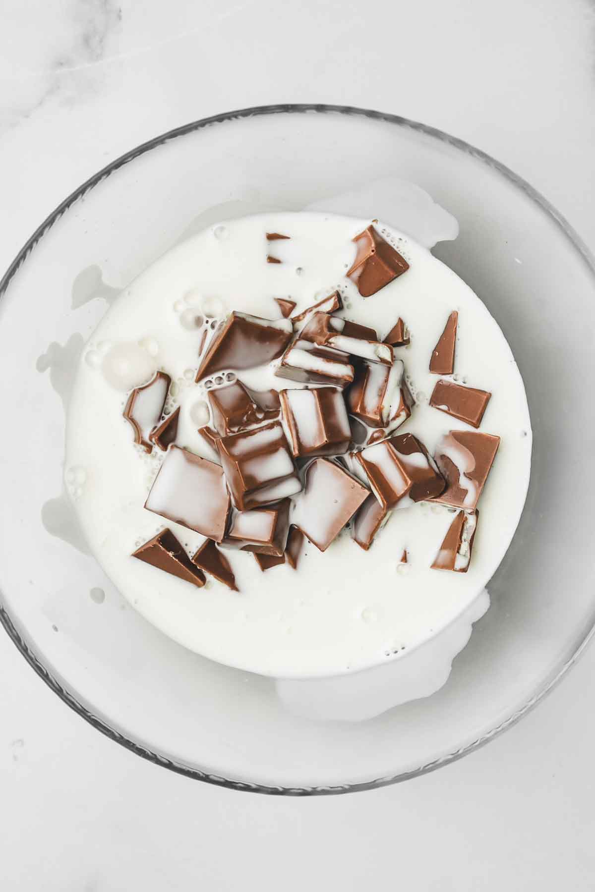 medium bowl with kinder chocolate pieces and heavy cream