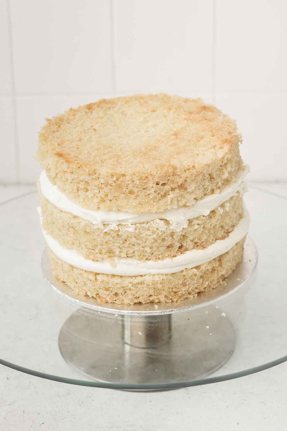 vanilla cake layered in a cake stand
