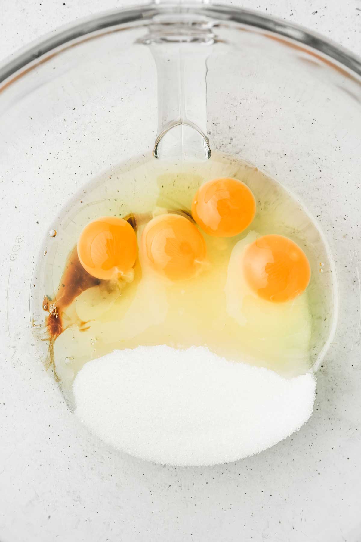 large bowl with eggs an sugar