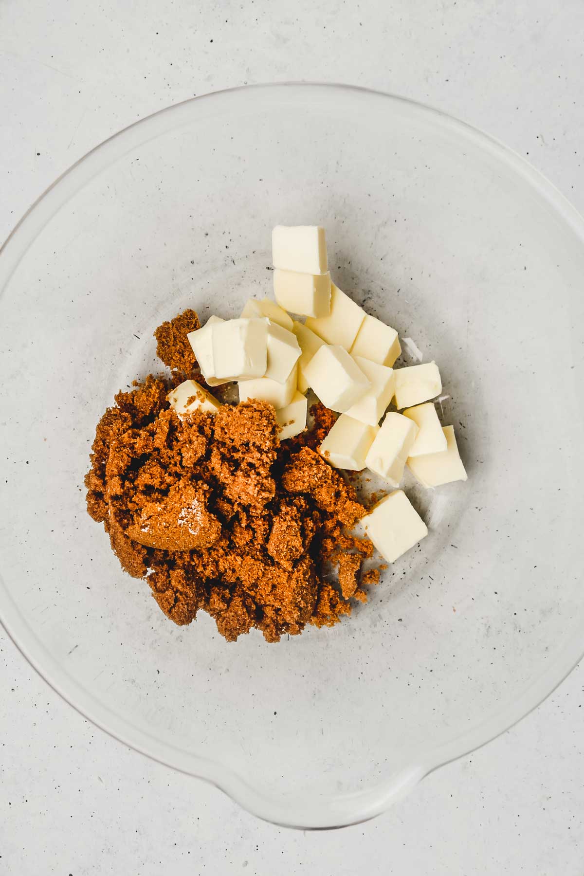 Large bowl with diced butter and brown sugar