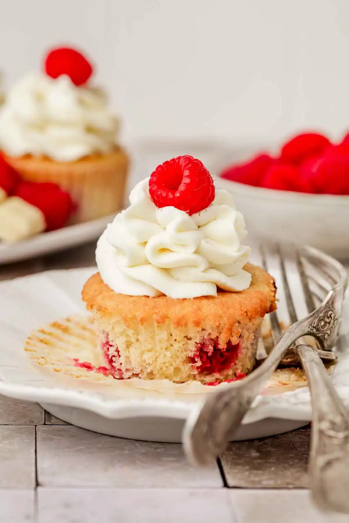 plate with raspberry cupcake and fork