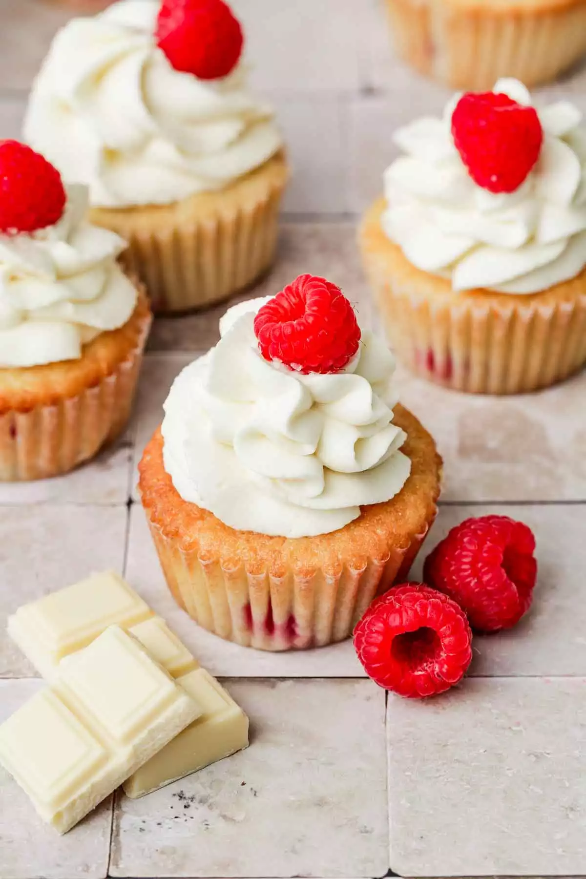 table with raspberry white chocolate cupcakes