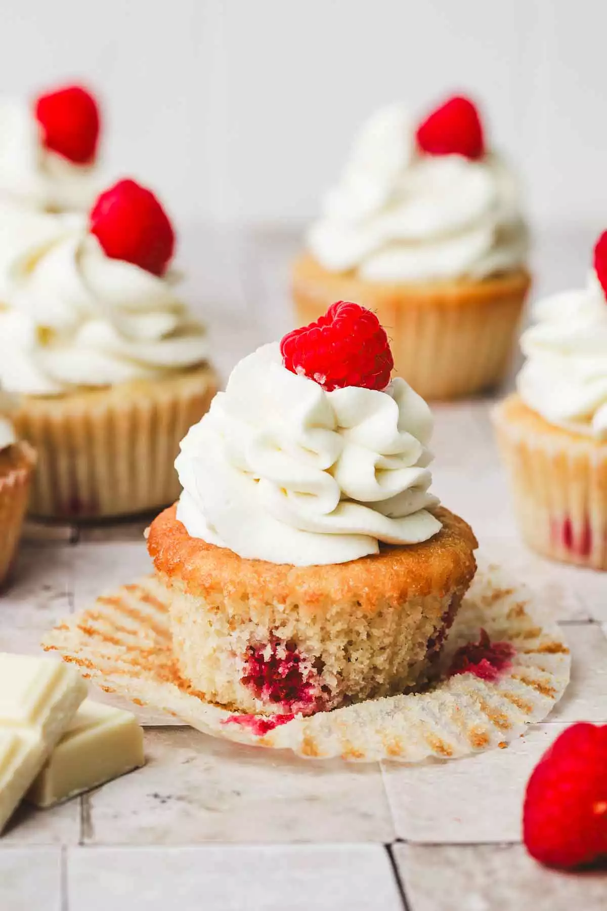 raspberry cupcakes on a table