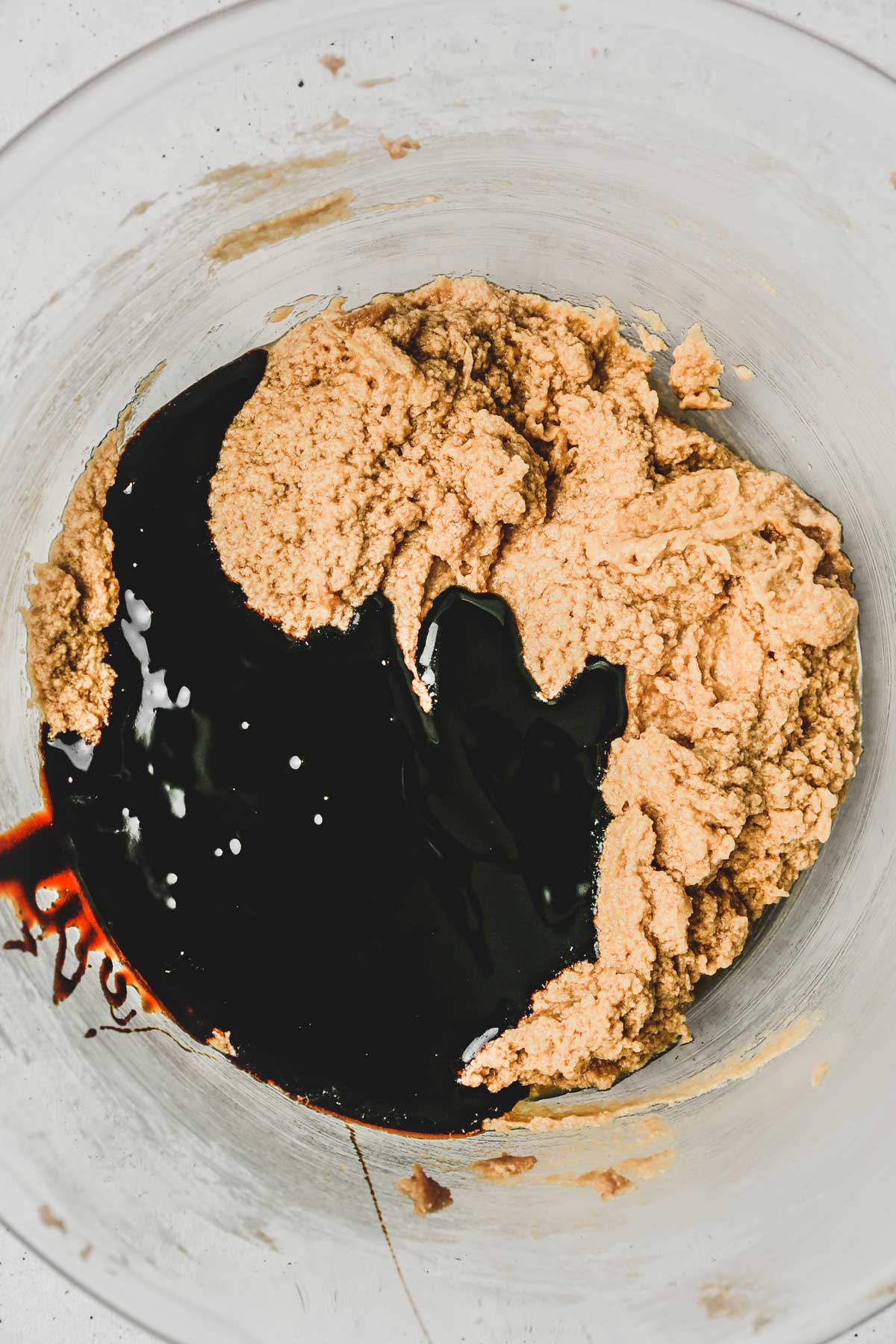 large bowl with molasses and ingredients
