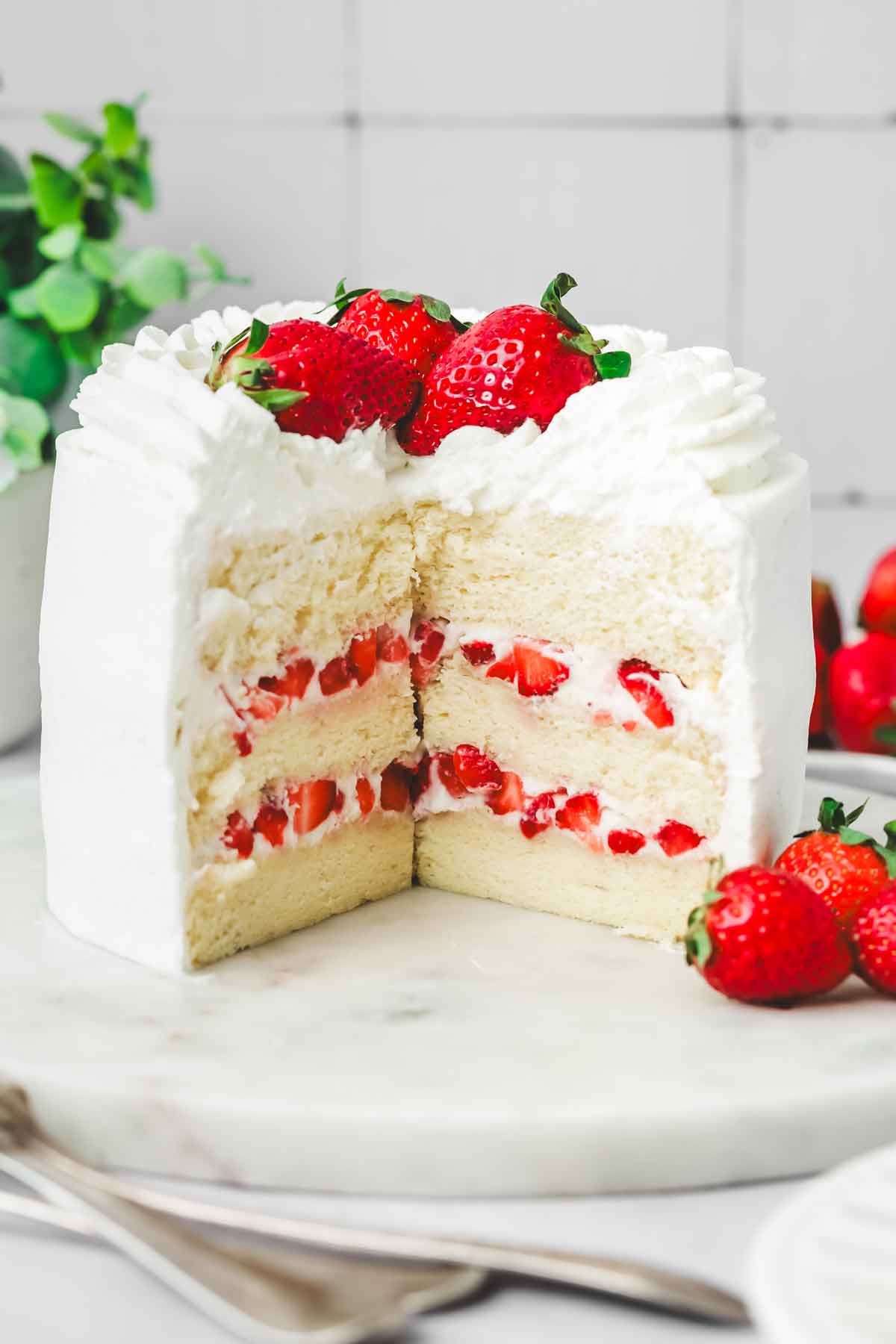 cut-off strawberry filled whipped cream cake