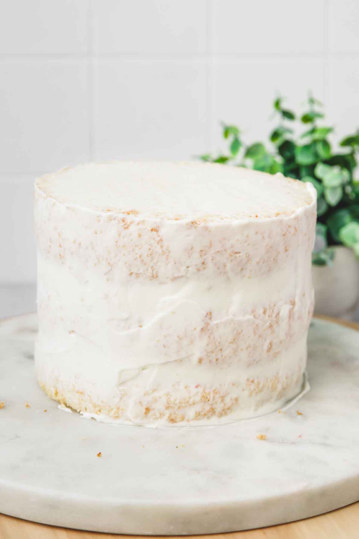 Cake layer covered with whipped cream frosting