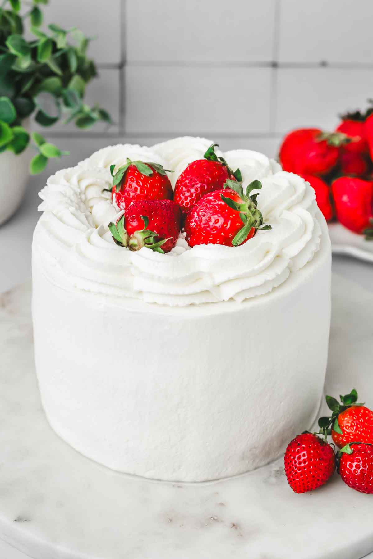 strawberry cream cake in cake plate