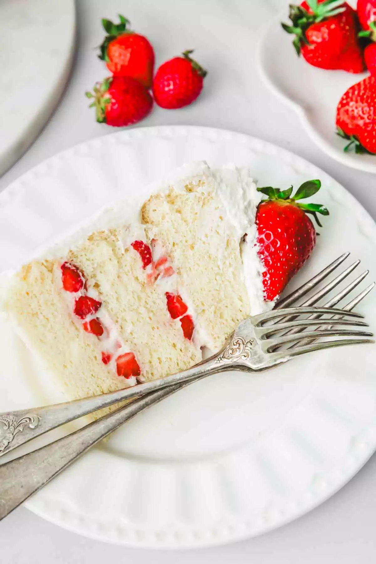 sliced strawberry cake in ap late