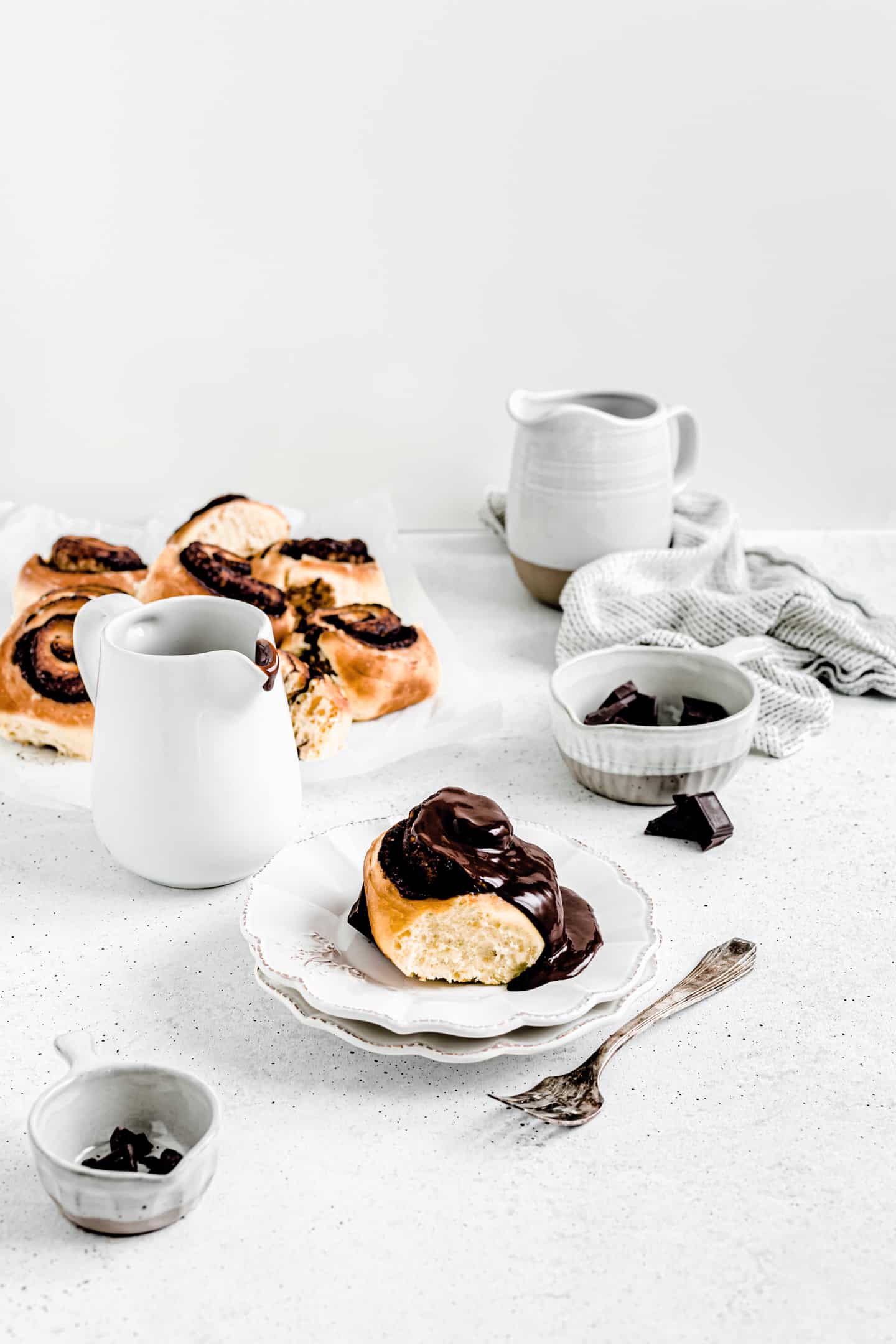 Table with chocolate sauce and chocolate roll