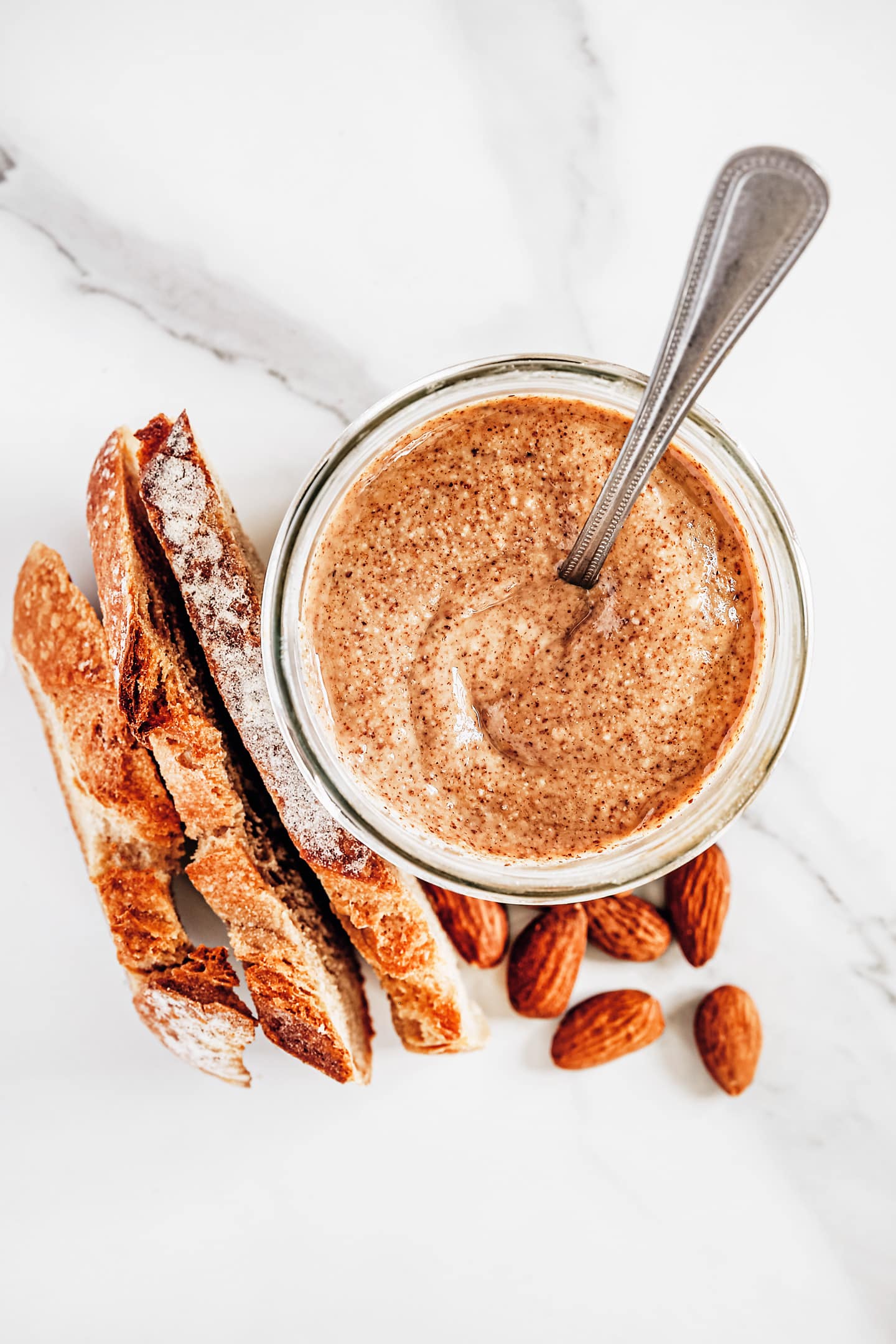 Jar with almond butter and bread