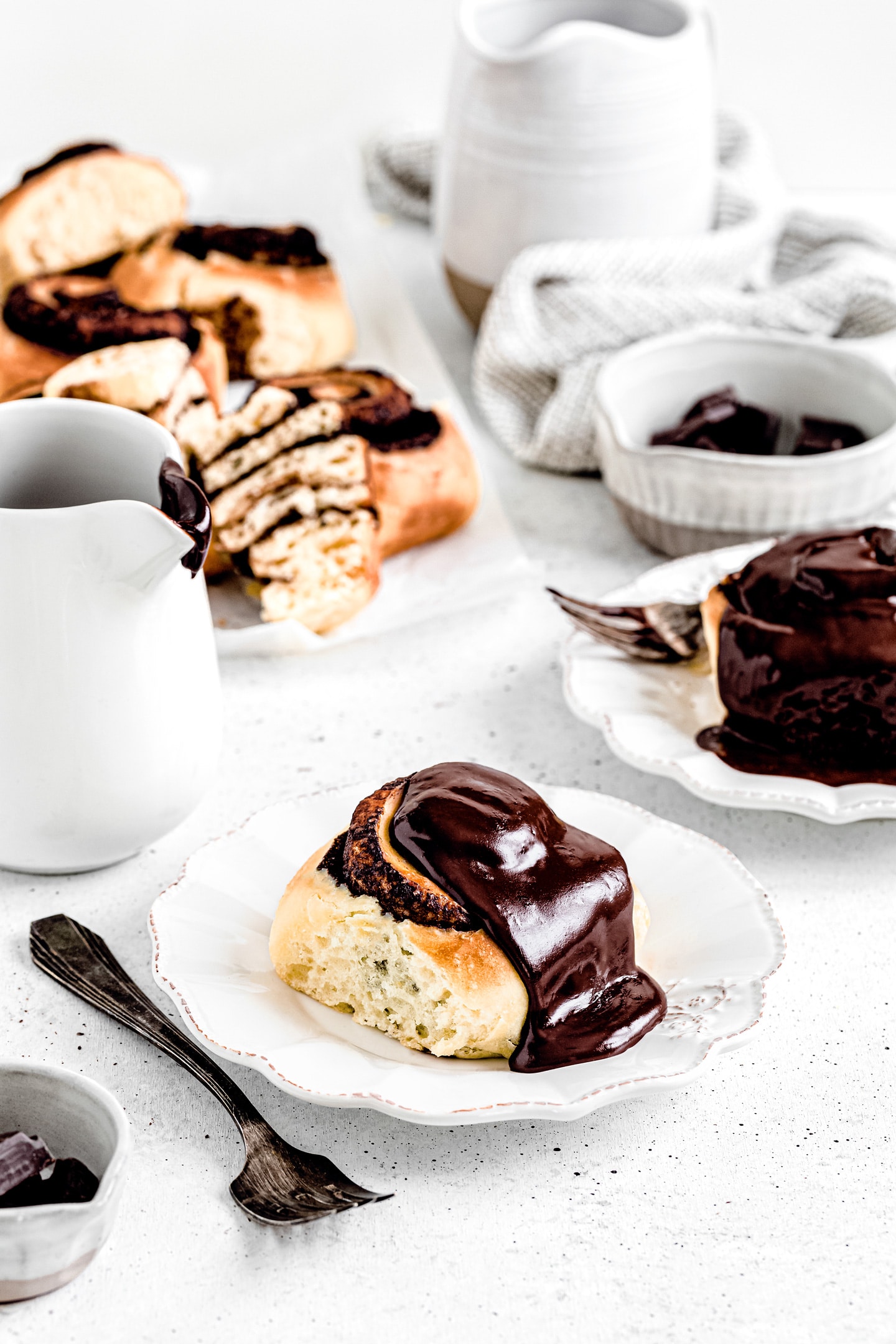Best chocolate cinnamon rolls recipe Chocolate rolls on a table with chocolate sauce