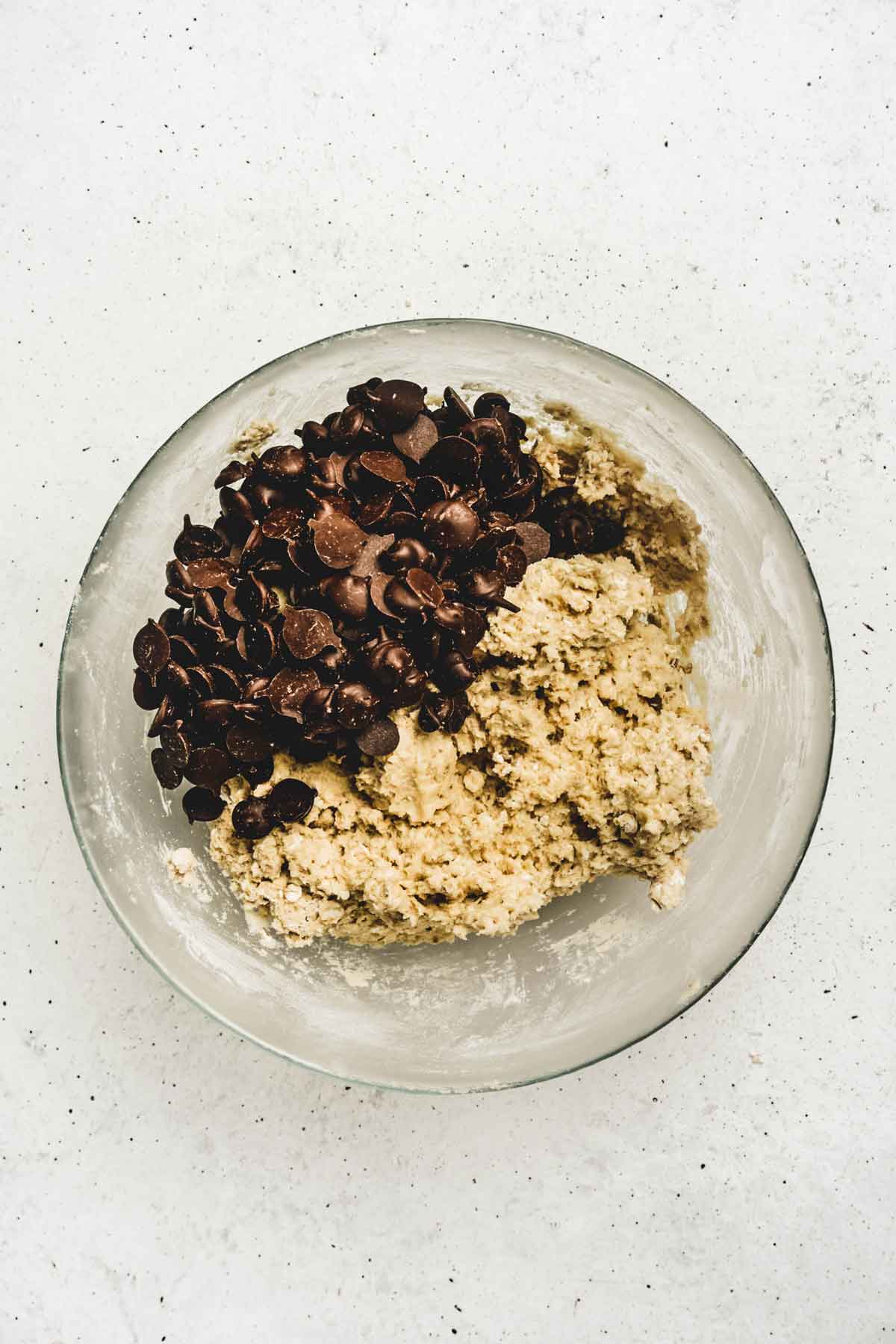 Medium bowl with chocolate chip and cookies batter