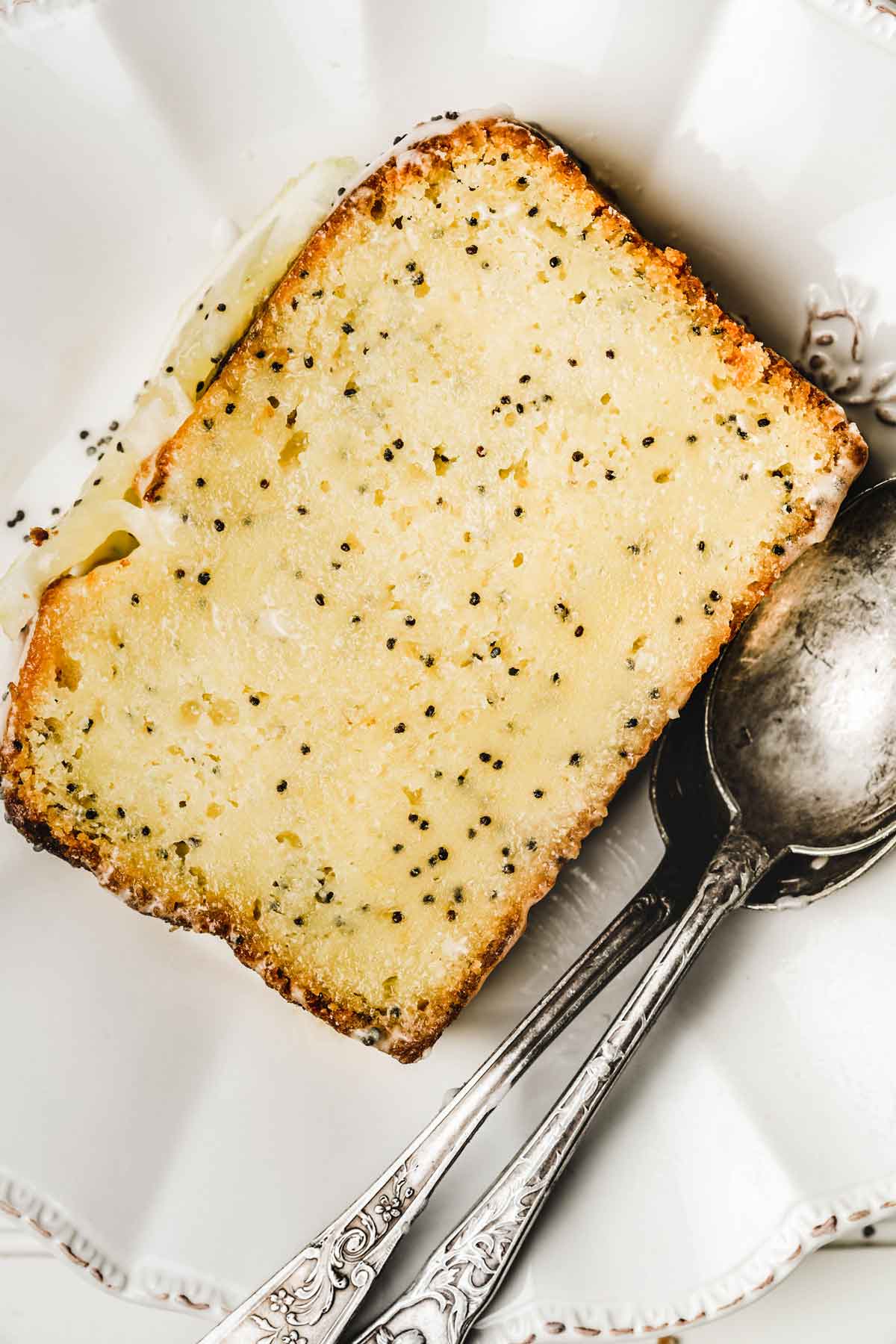 Lemon poppy seed cake slice on a plate