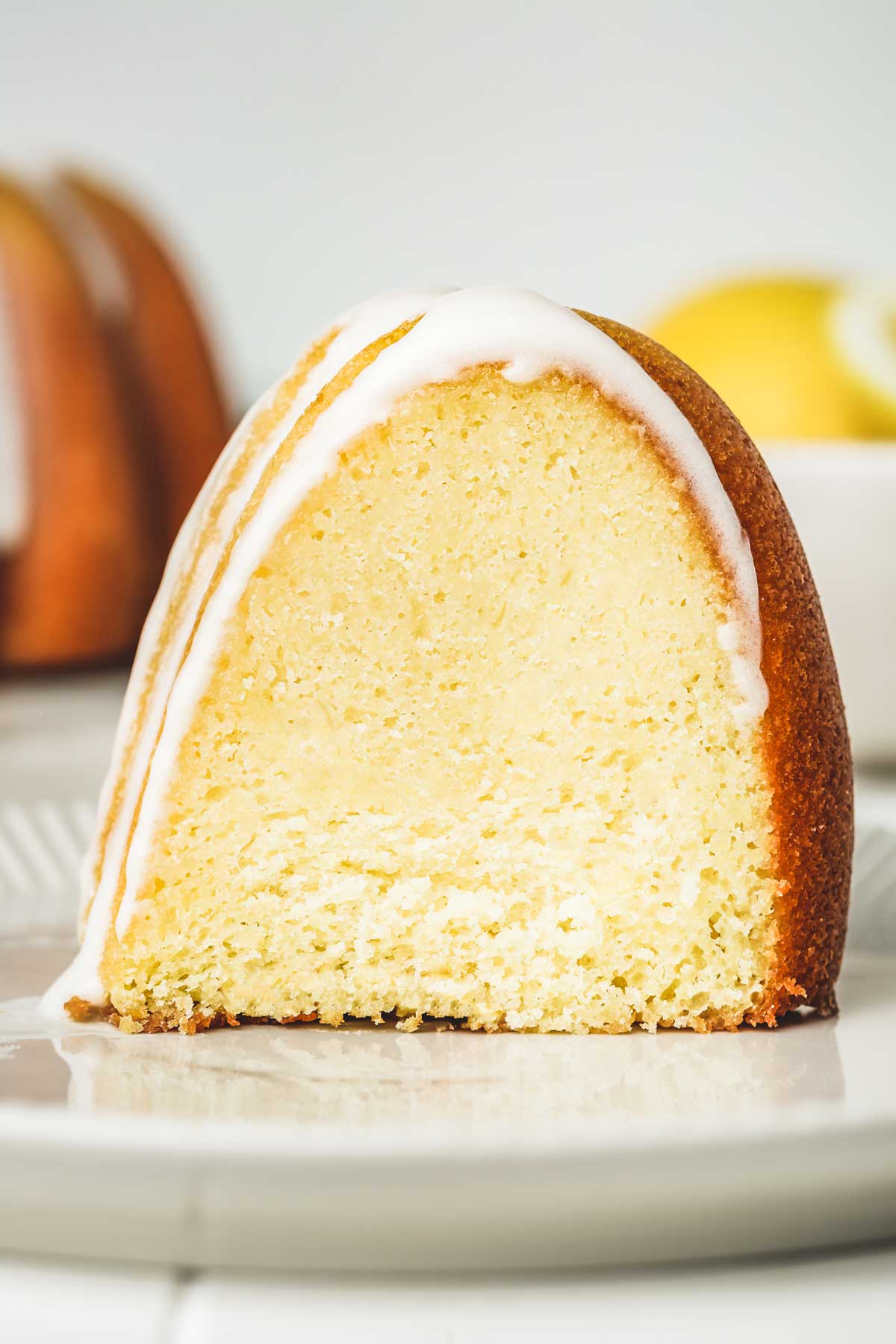 sliced lemon bundt cake with lemon glaze