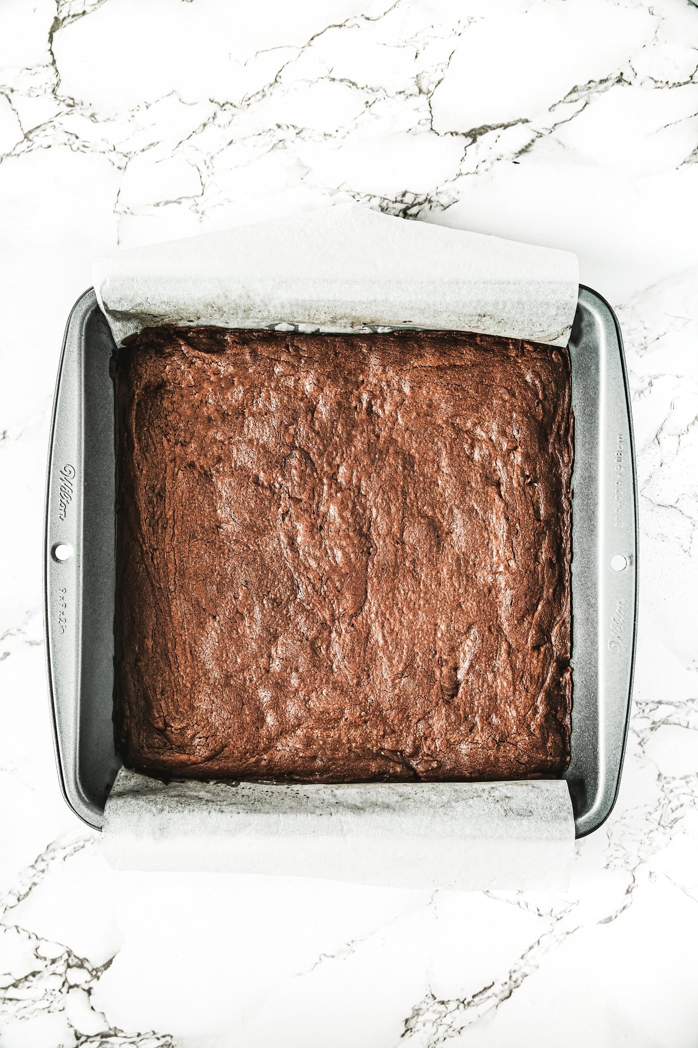 baked brownie on a cake pan