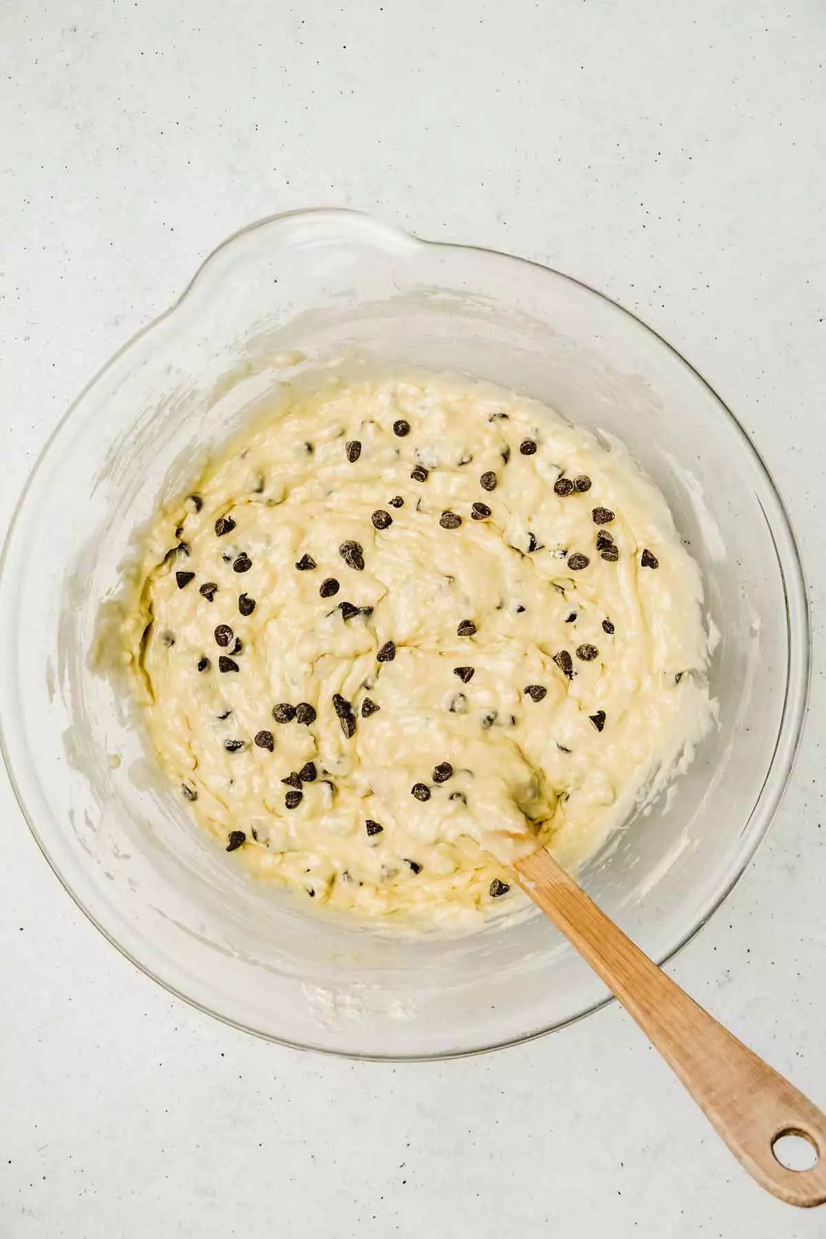 Large bowl with chocolate chip muffins batter