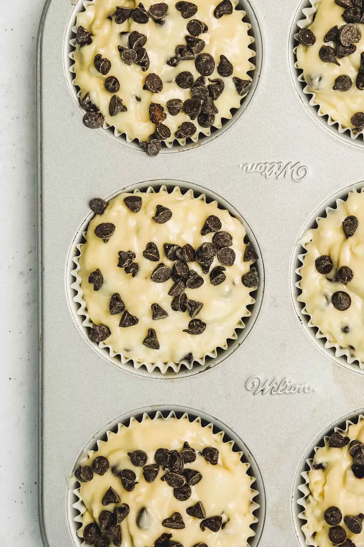 Muffin tins with row muffin before baking