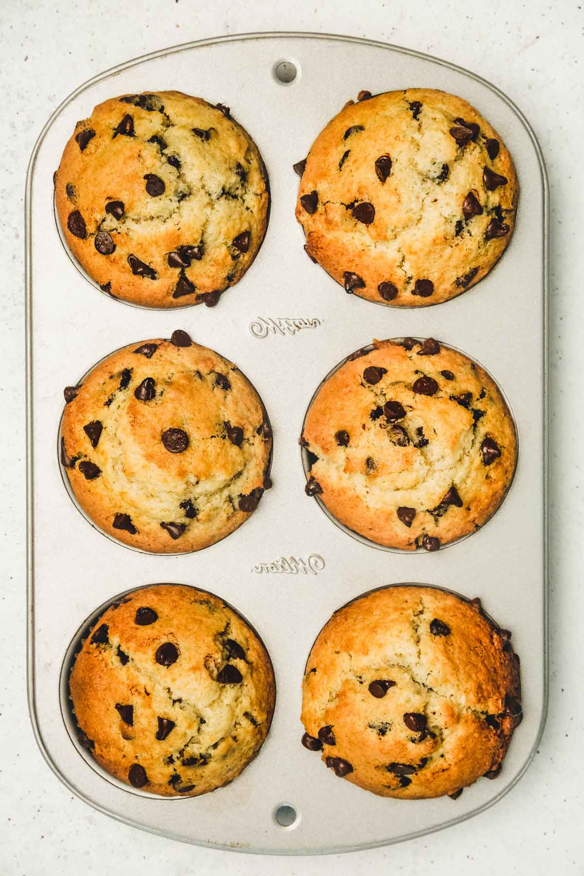 Muffin tin with baked muffins