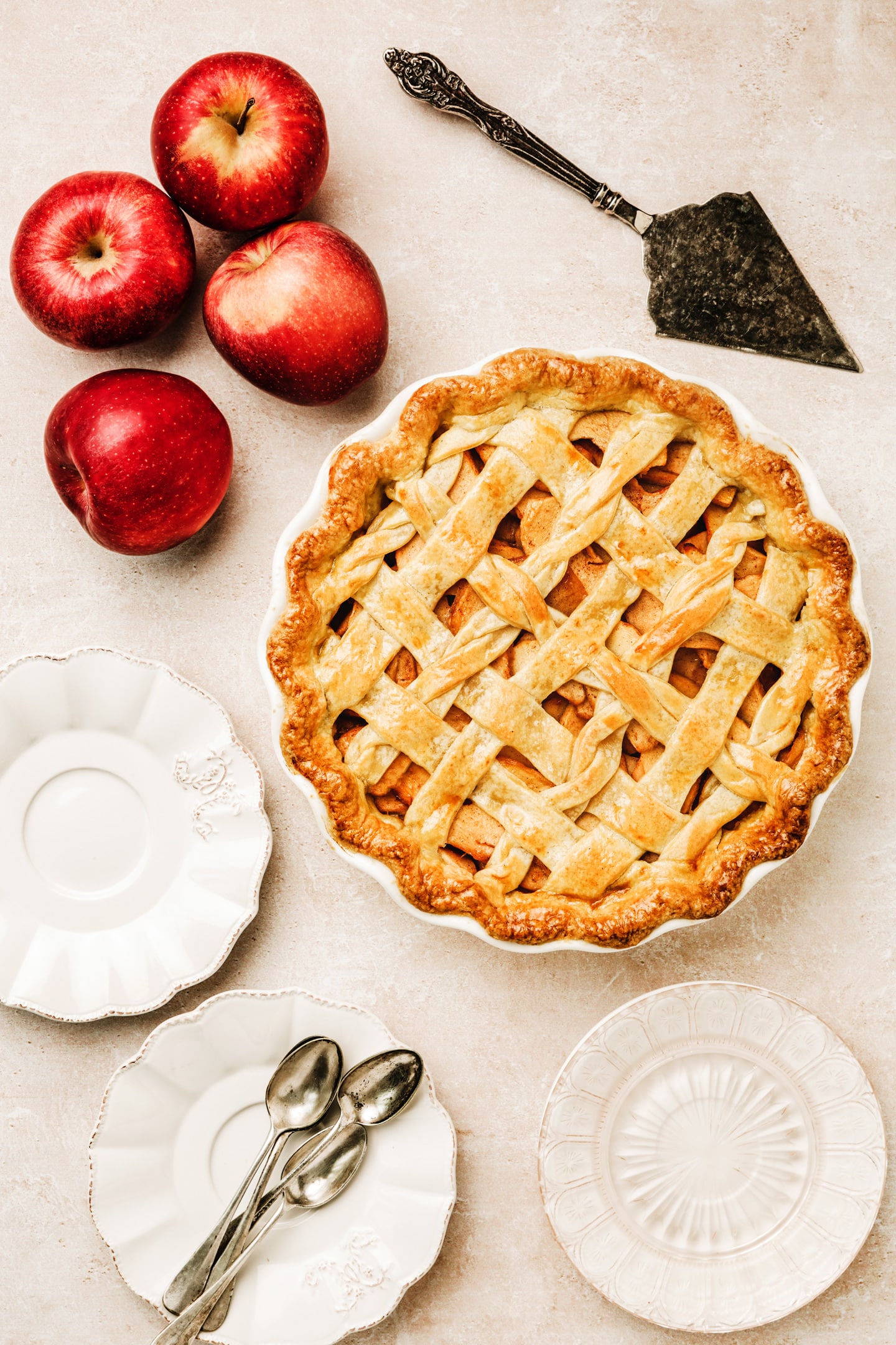 Apple pie on a pie plate on a table
