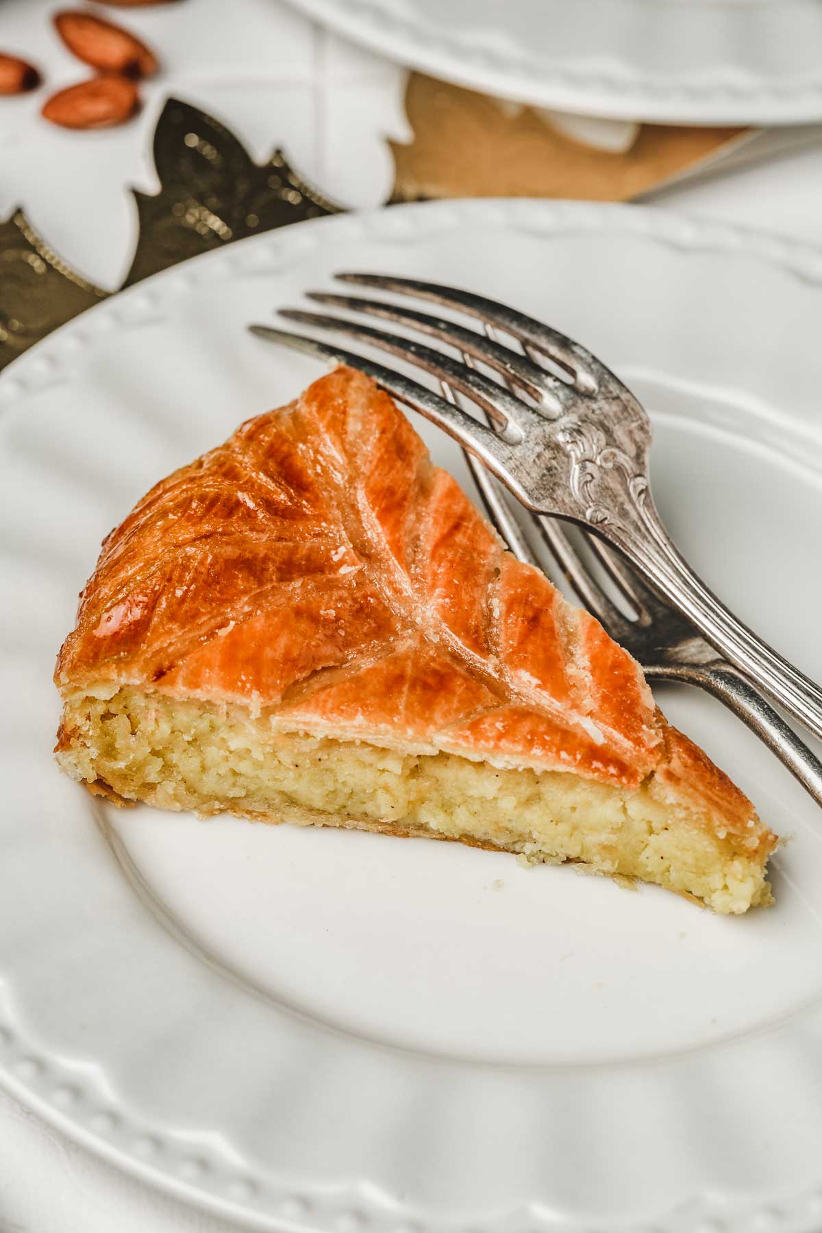 one slice of galette des rois on a plate