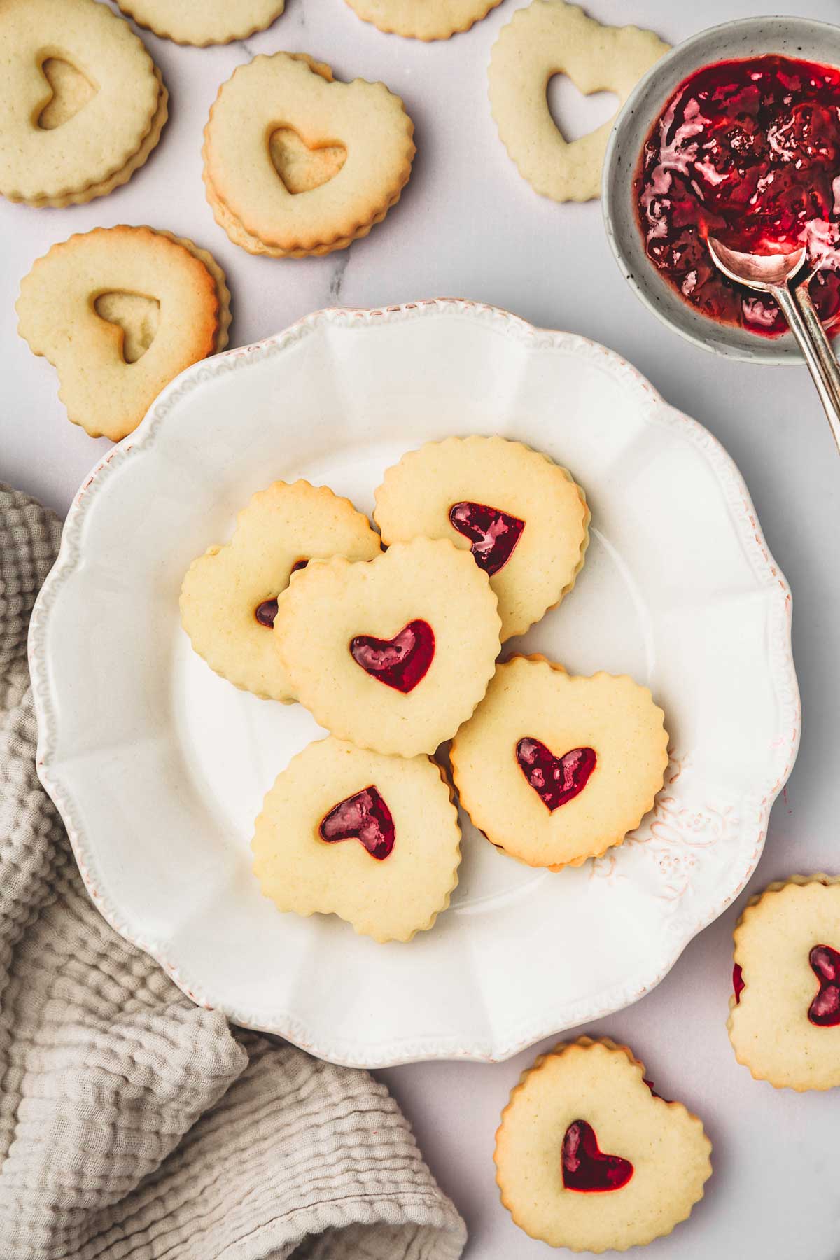 strawberry jam linzer cookies on a plate