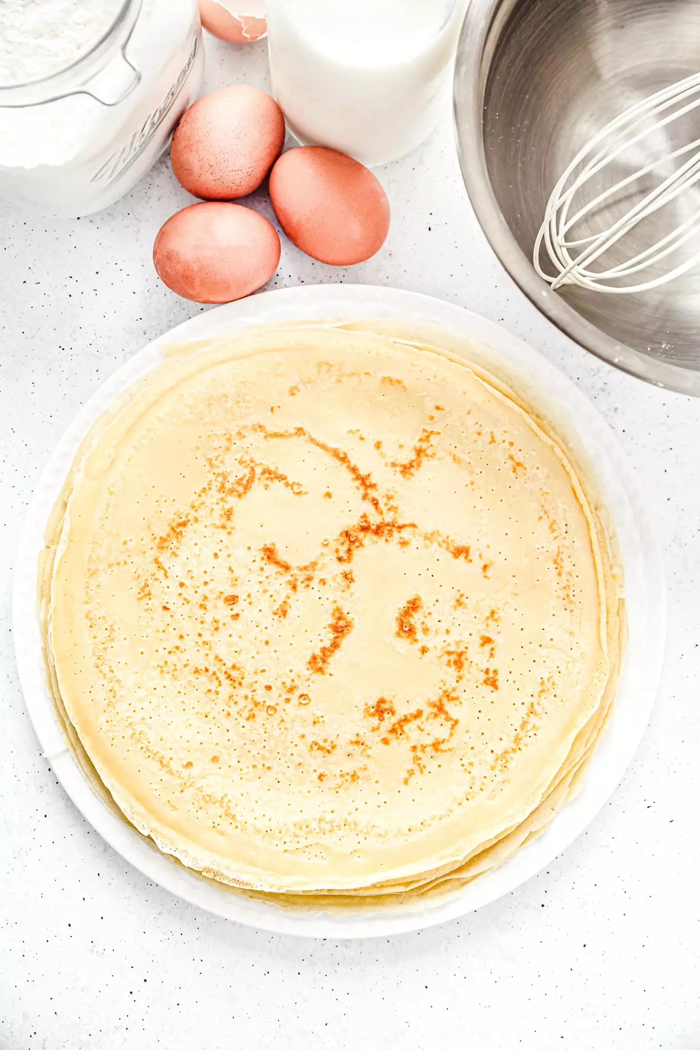 Crepes on a table with eggs