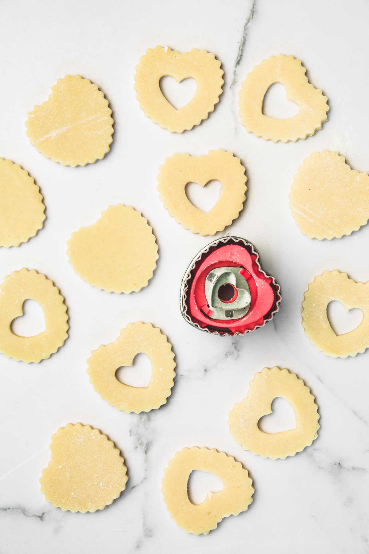 Cut-out shortbread pieces: solid bases and heart-window tops