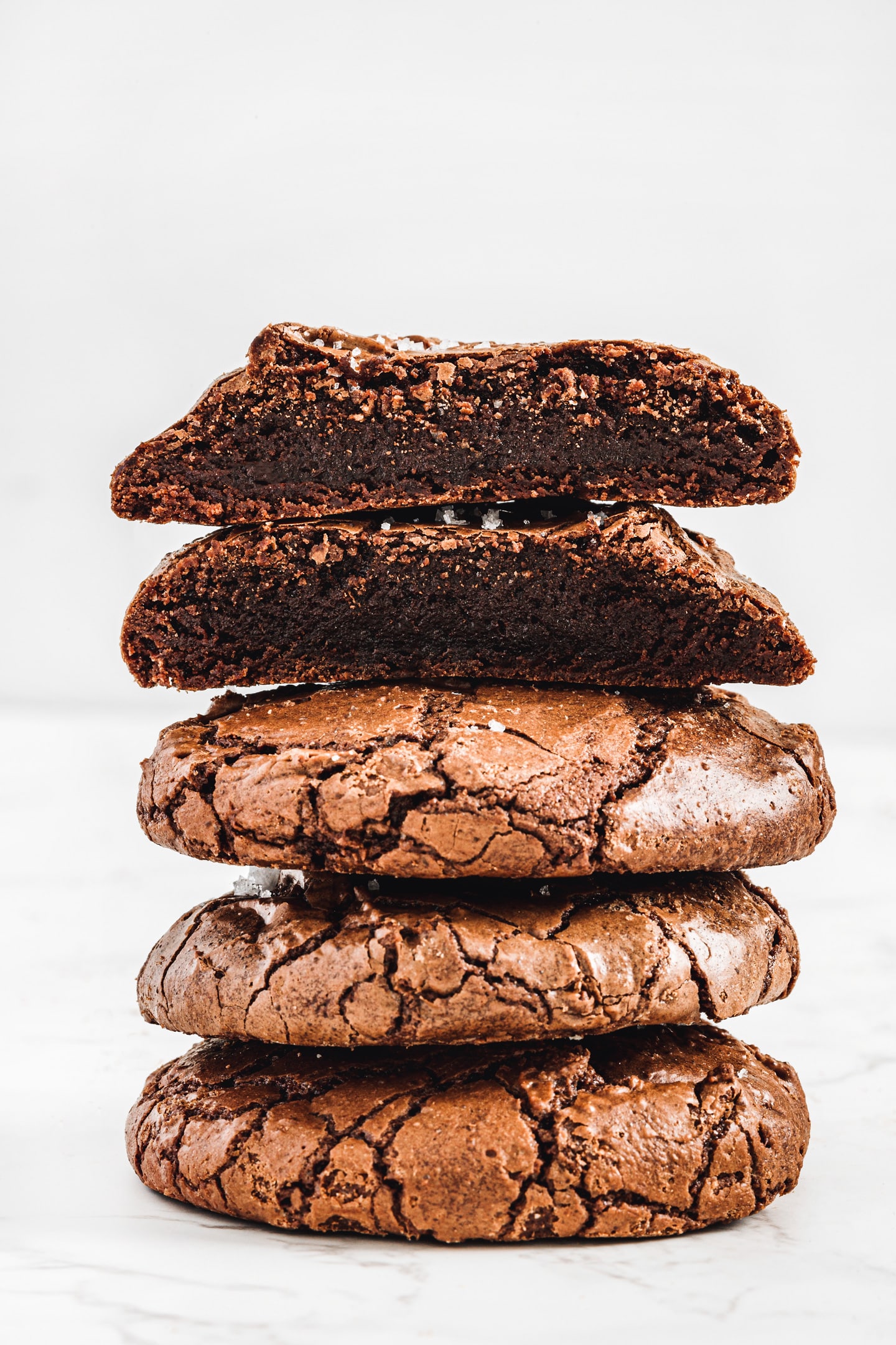 Stack of brownie cookies with one cut in half