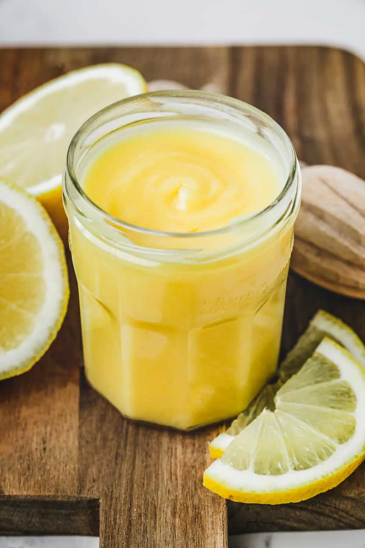 lemon filling on a jar in a wood board