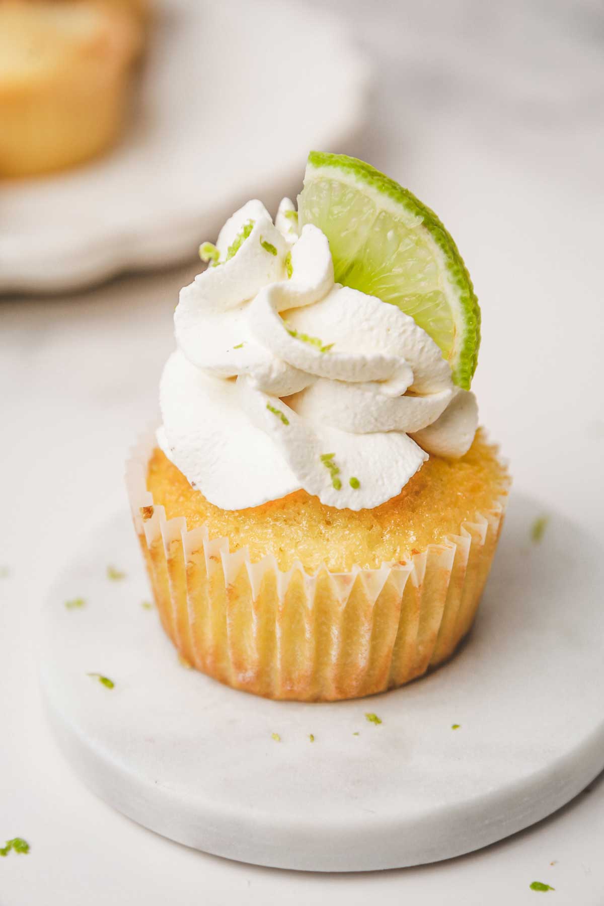 mascarpone frosting and lemon curd cupcakes on a table