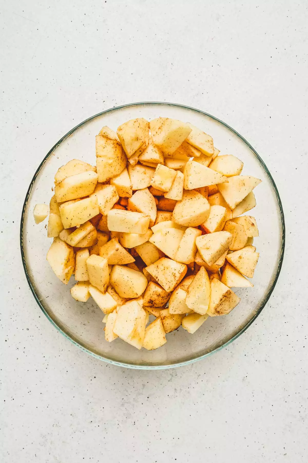 Bowl with apple chunks and cinnamon