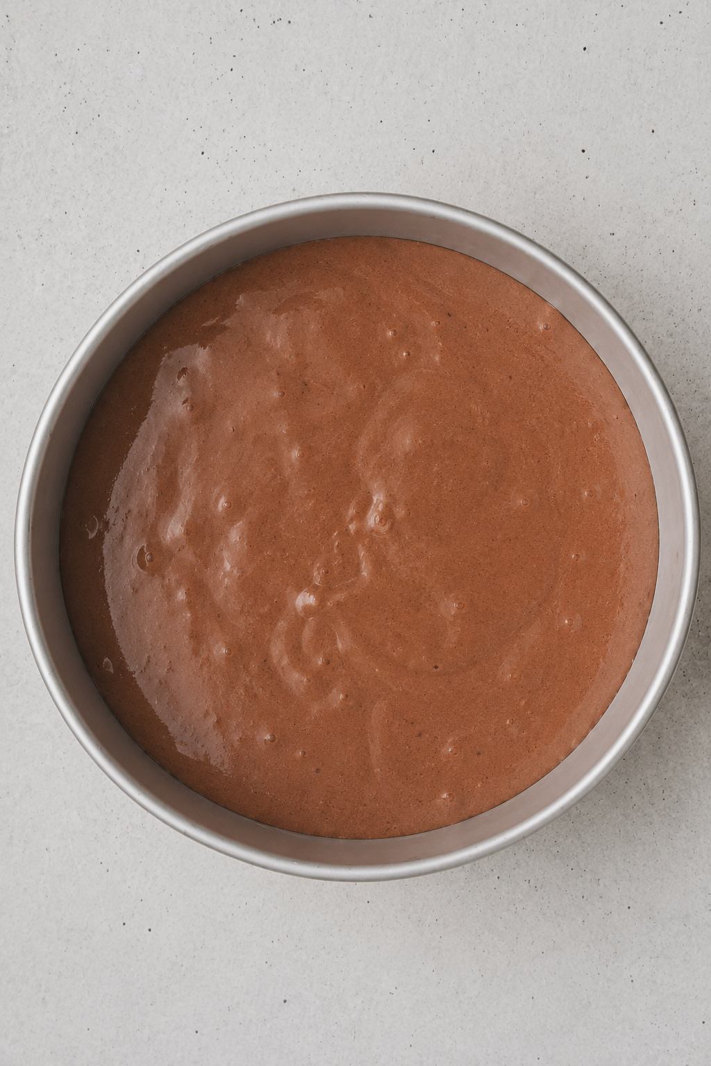 Chocolate genoise sponge cake sliced into layers