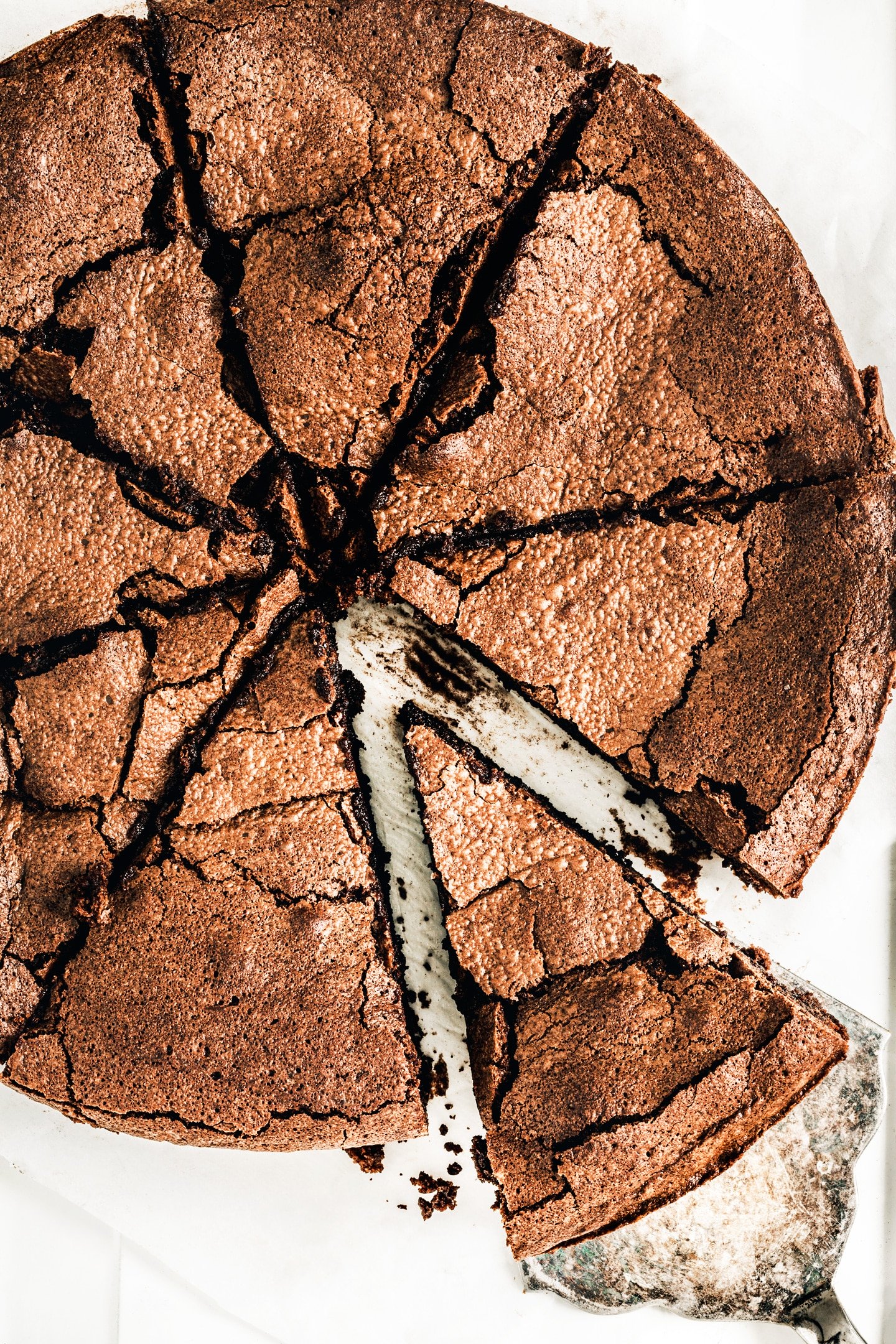 Flourless crunchy chocolate cloud cake cut in several slices