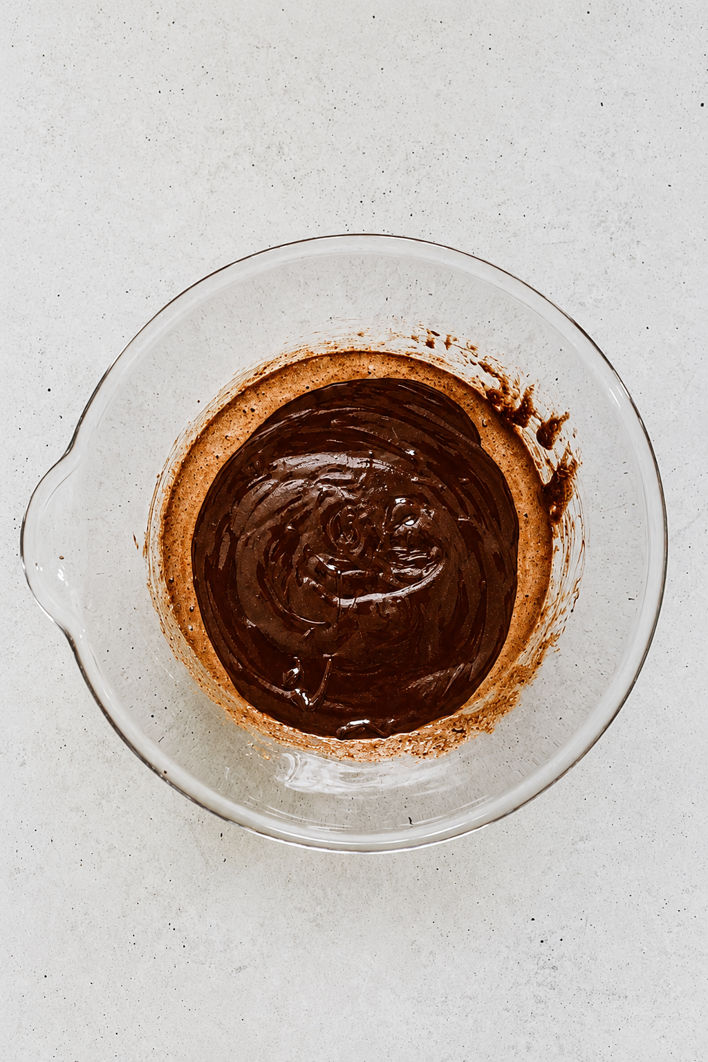 chocolate batter with melted chocolate and butter for flourless chocolate cake