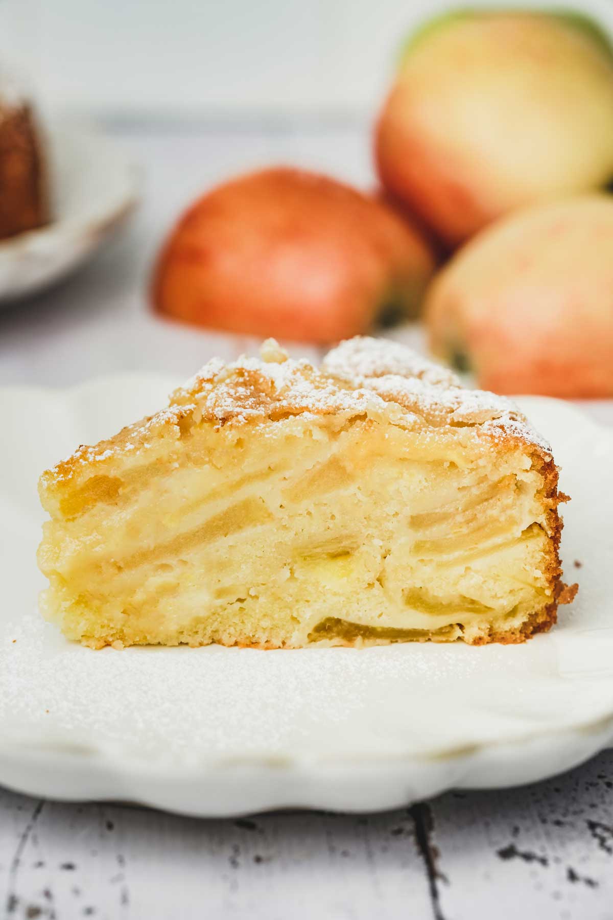 sliced french apple cake on a plate