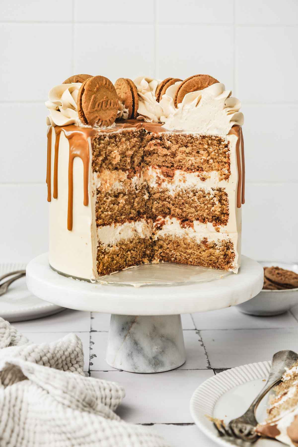 cut out biscoff layer cake on a cake stand