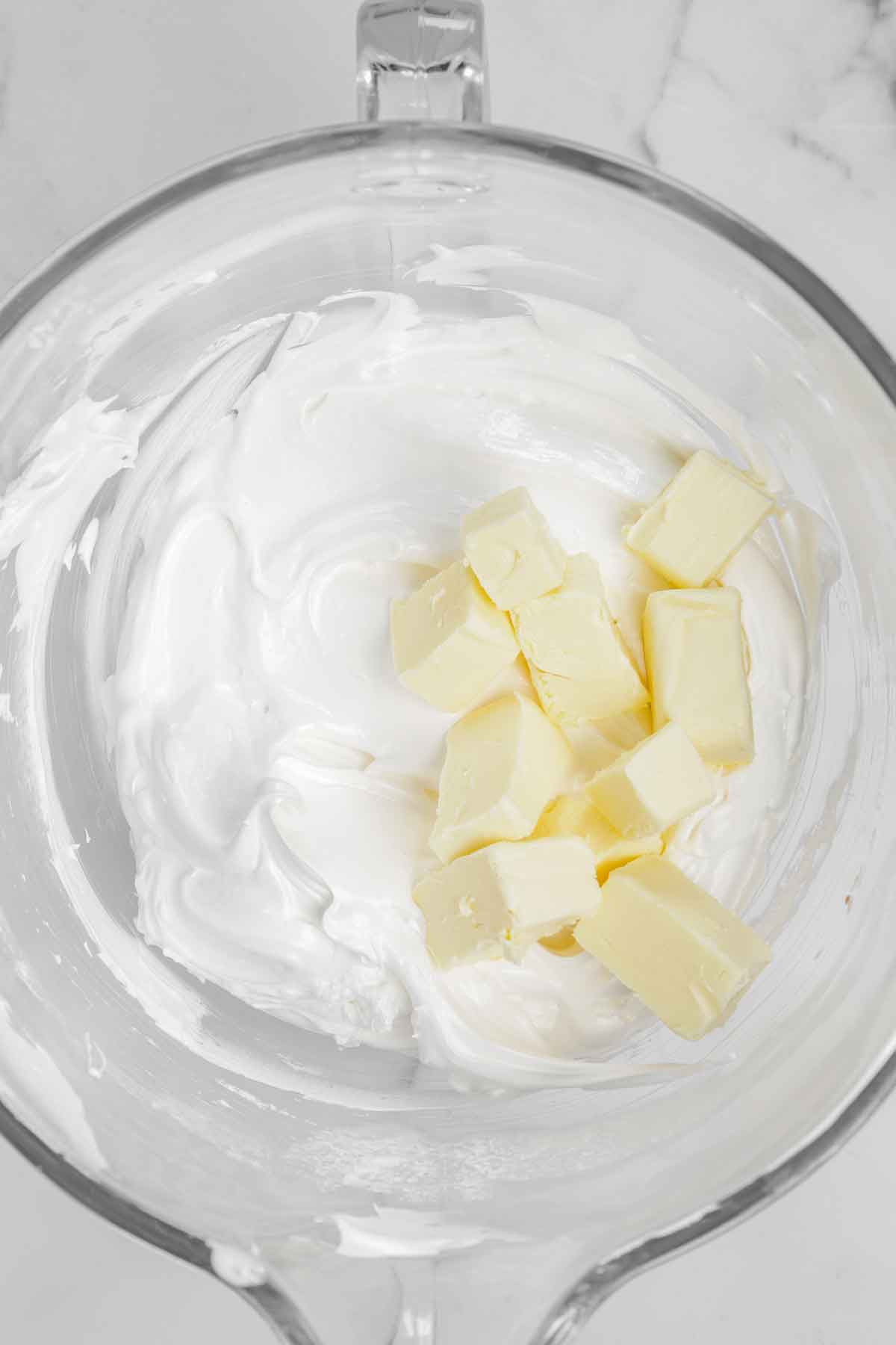 large mixing bowl with meringue and butter