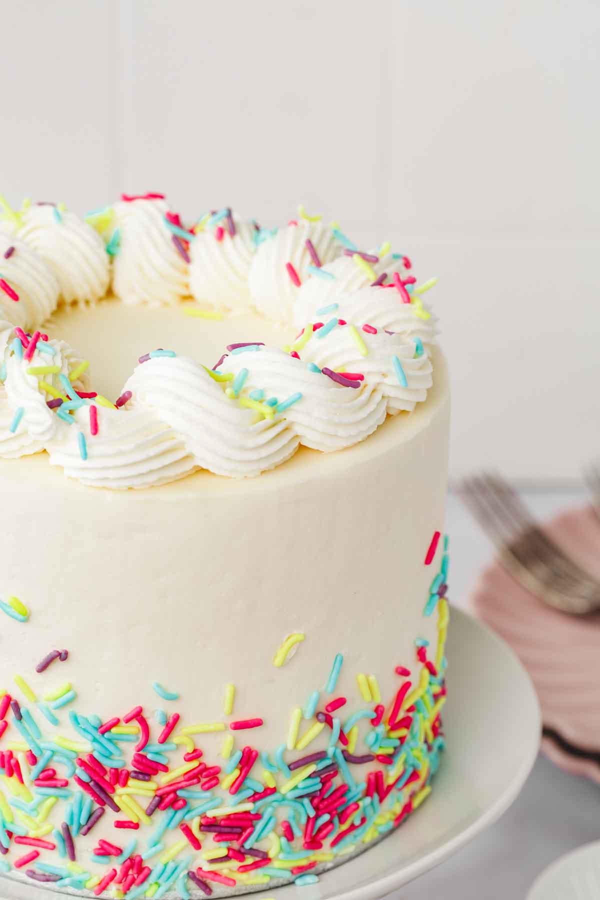 frosted vanilla cake with sprinkles