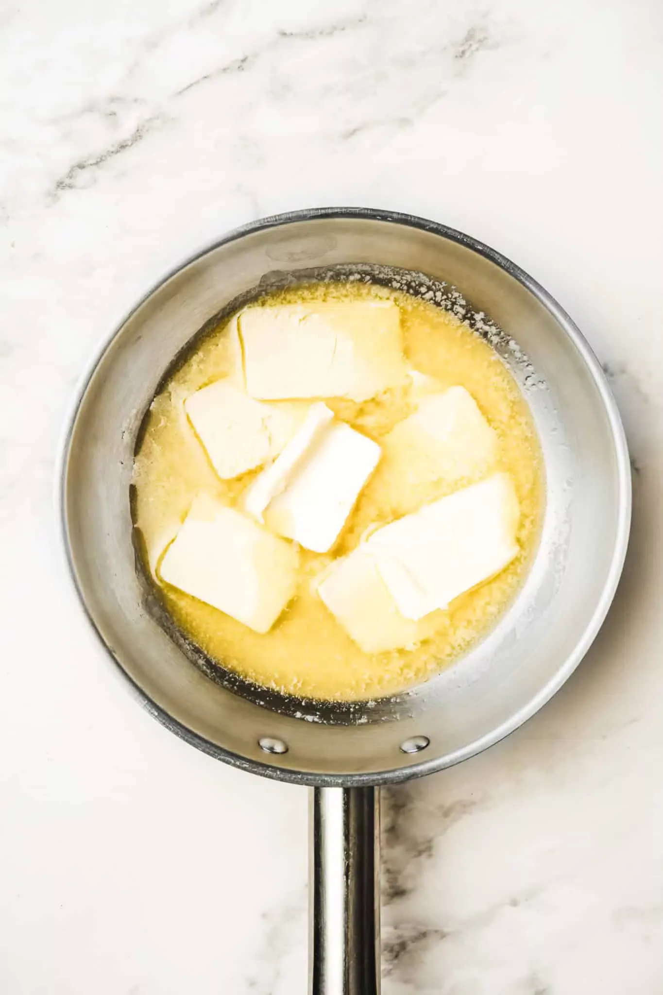 saucepan with diced butter