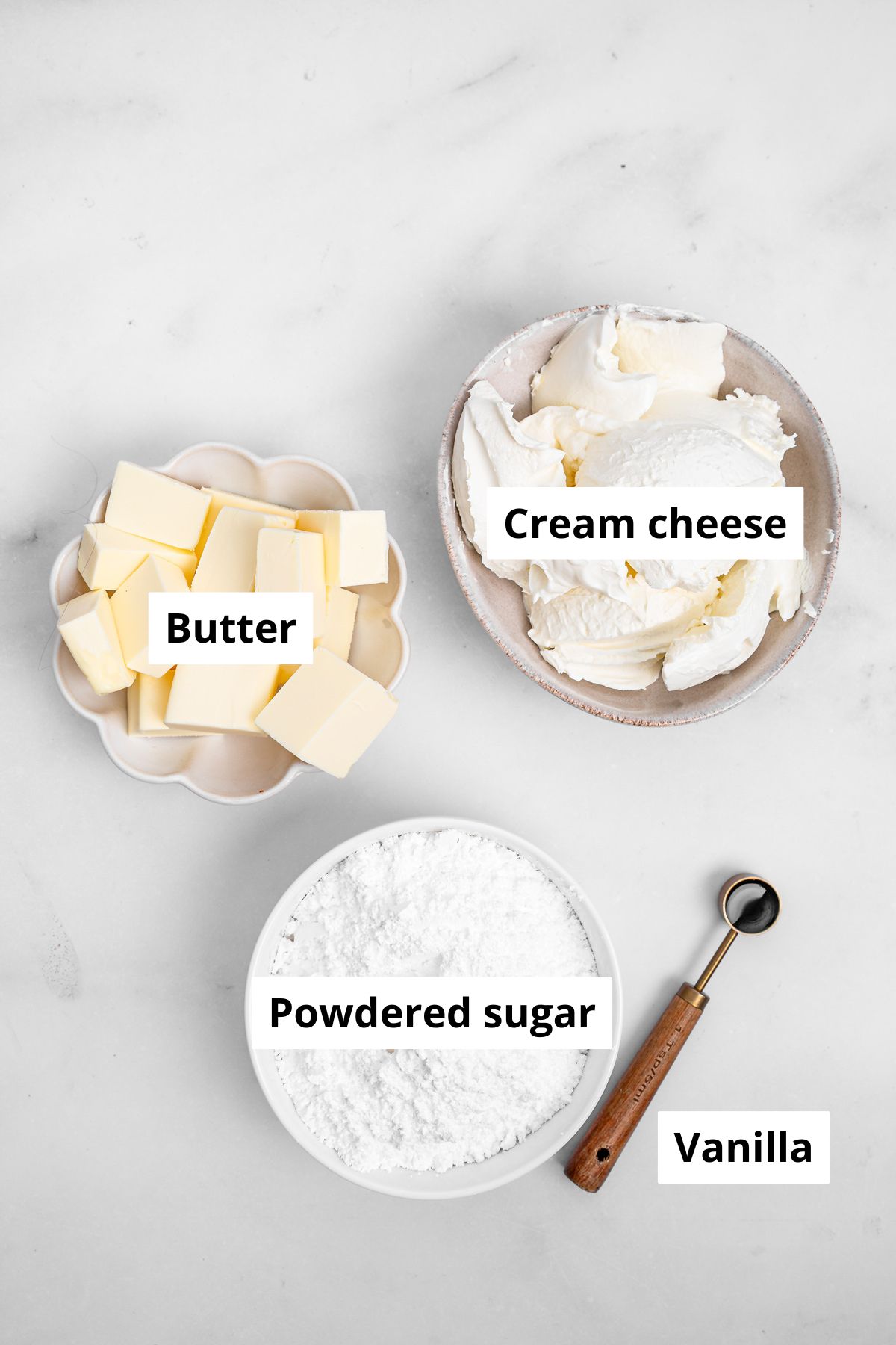 Bowls with ingredients to make cream cheese frosting