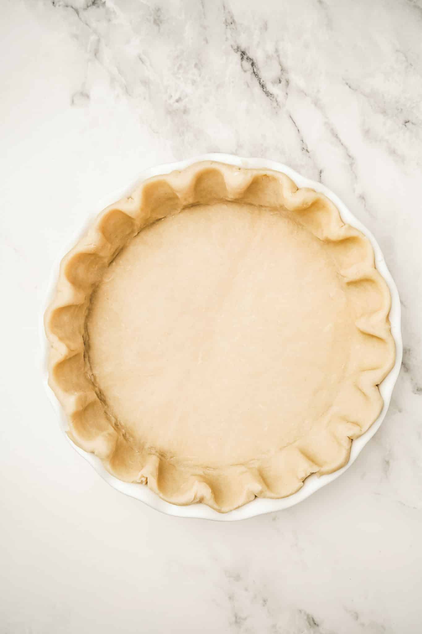 Pie dough on a pie dish