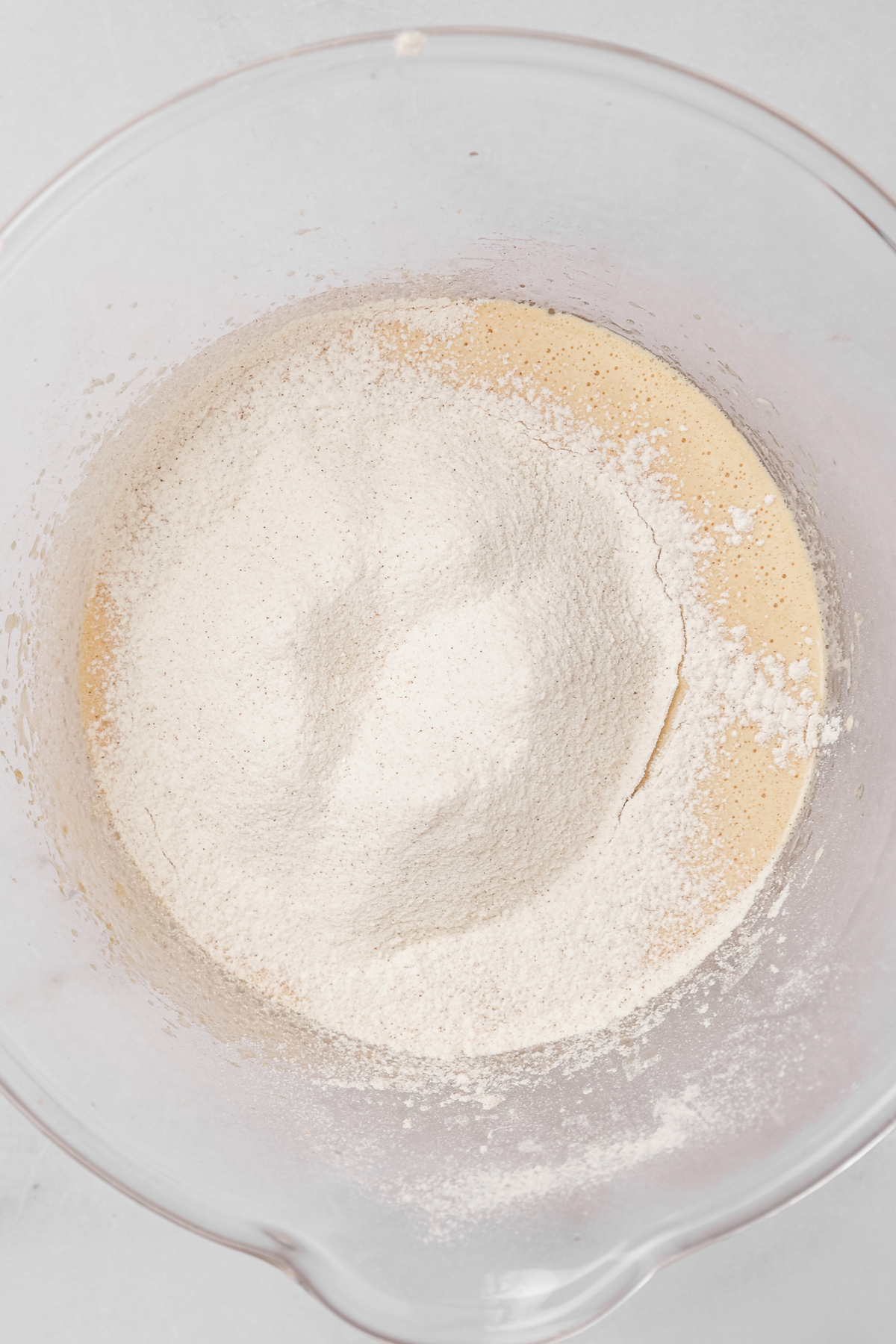 Mixing eggs, oil, sugar, and vanilla for carrot cake cupcakes batter