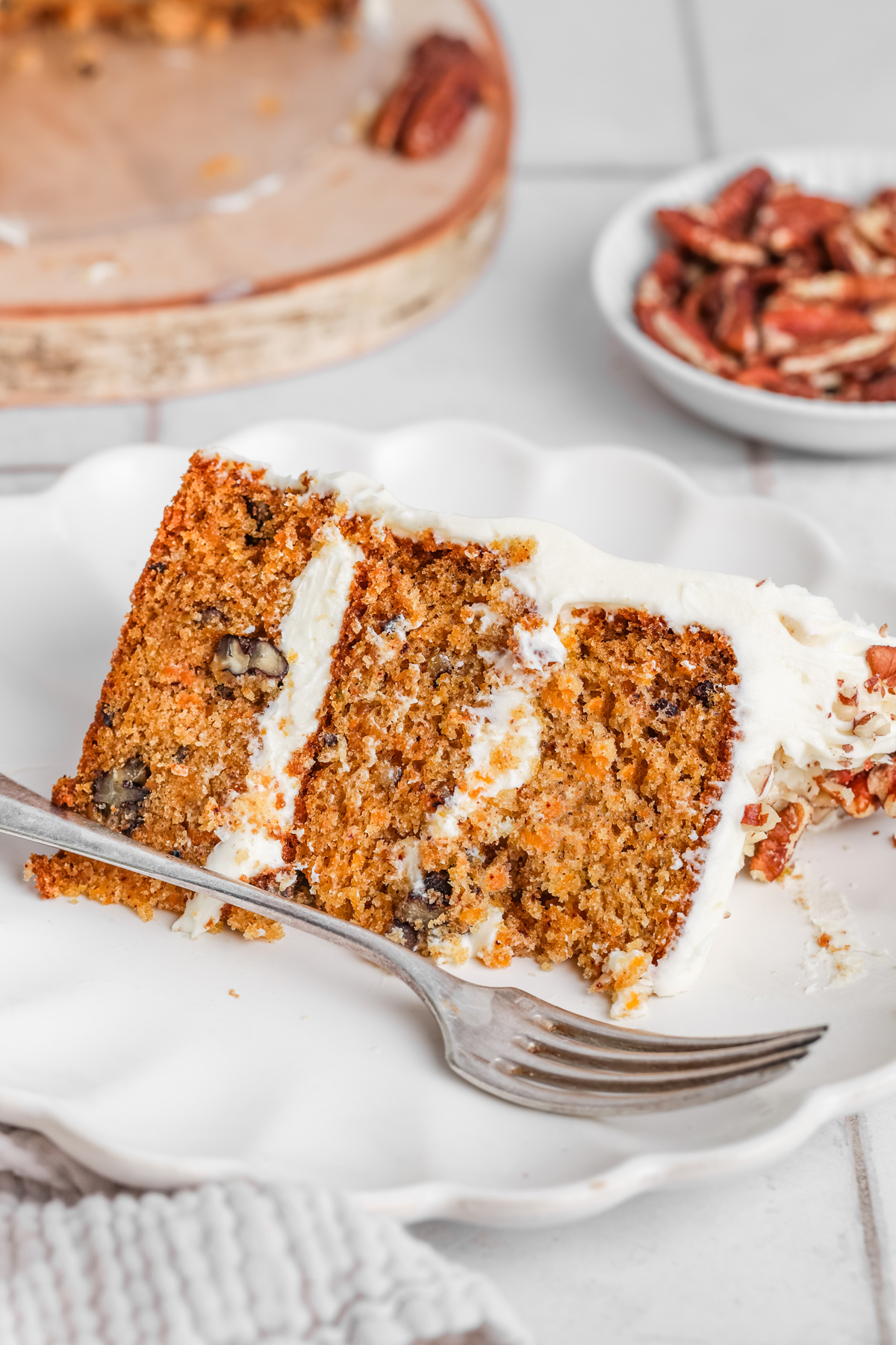 Slice of carrot cake served on a plate