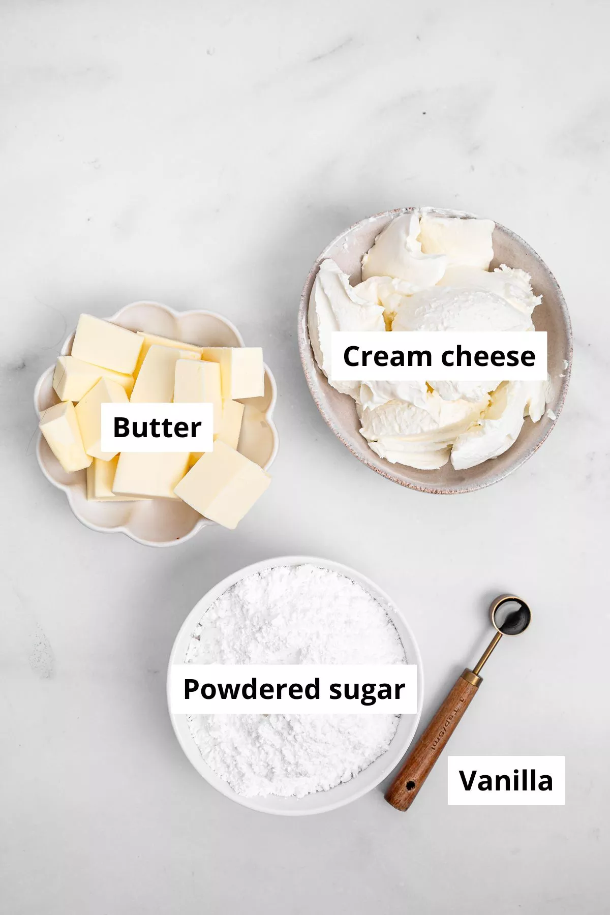 Bowls with ingredients to make cream cheese frosting