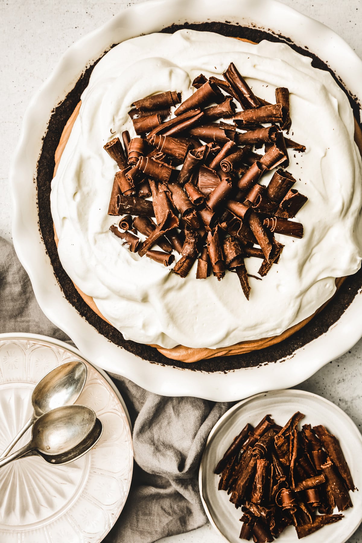 Chocolate mousse pie with whipped cream on a pie dish