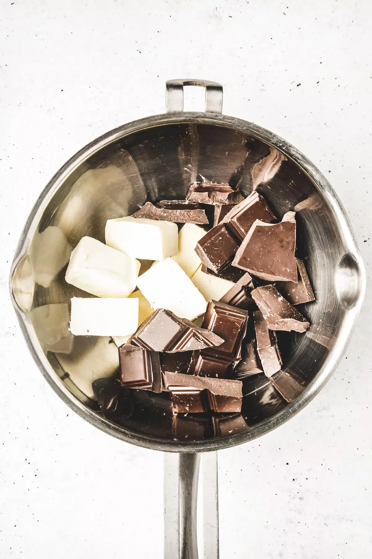 Bowl with butter and chopped chocolate