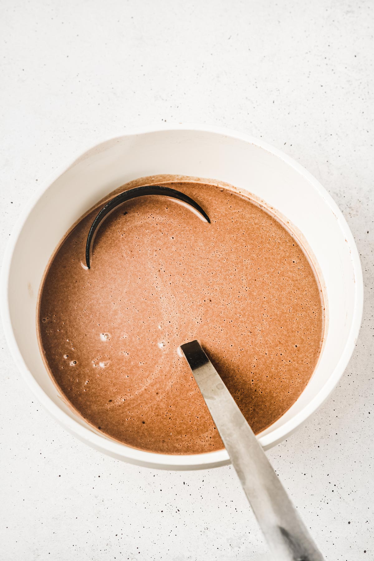Chocolate crepes batter in a mixing bowl