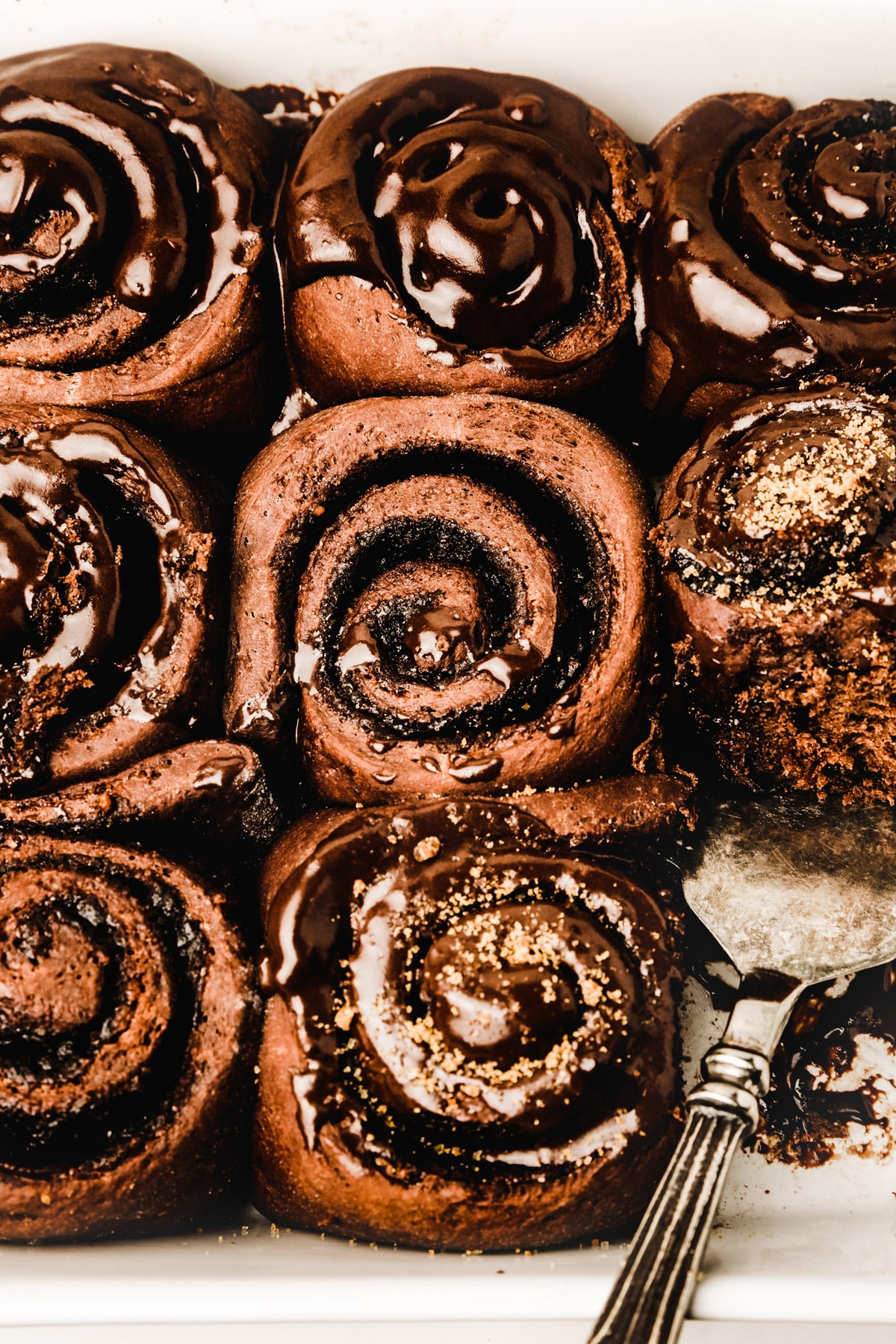 Chocolate rolls with chocolate glace on a dish