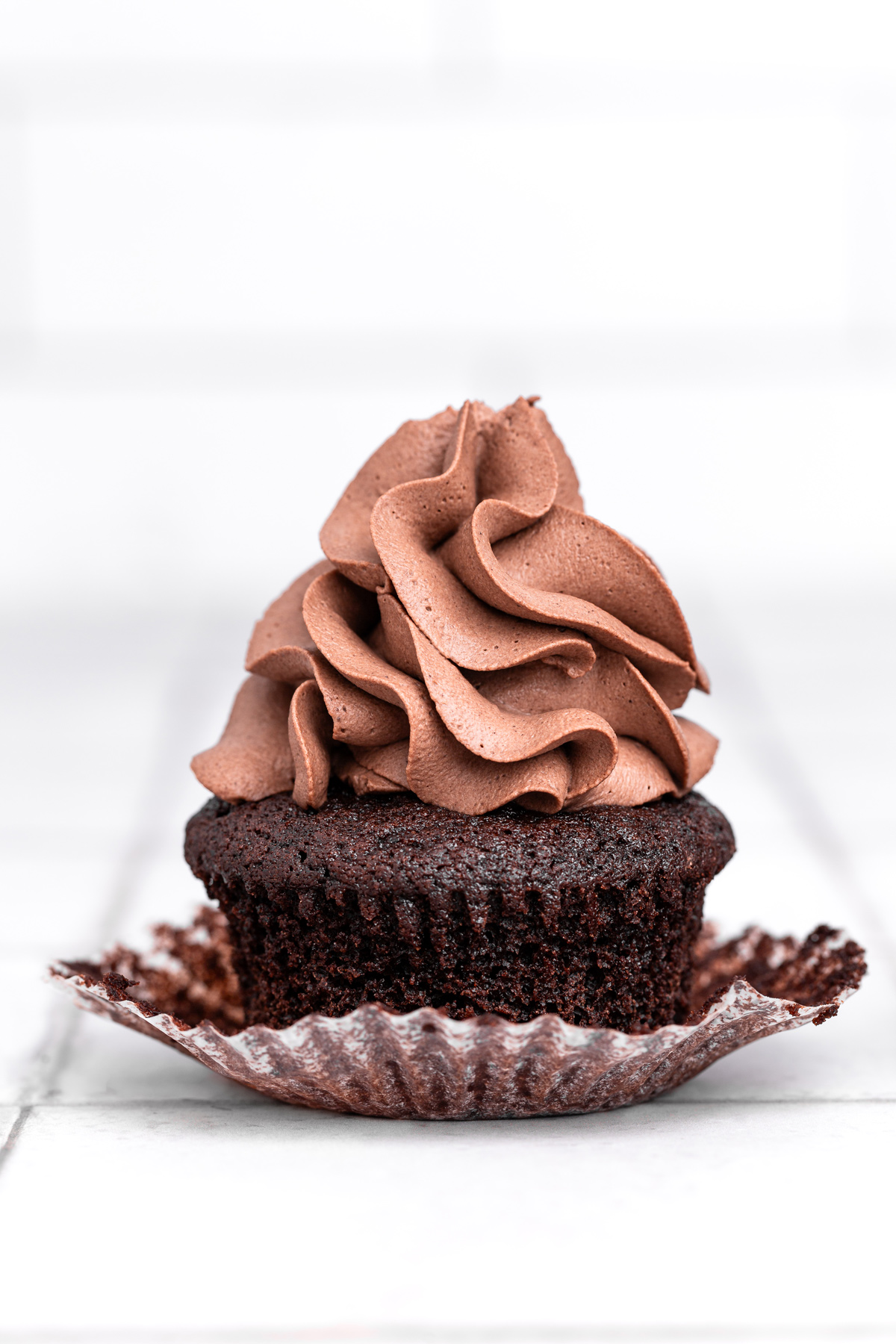 chocolate cupcakes topped with chocolate mascarpone frosting